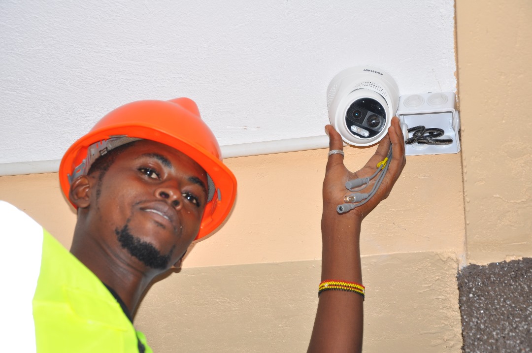 GEP TSS technician installing a Hikvision dome camera